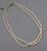 A double strand graduated cultured pearl choker necklace with diamond set 9ct white gold clasp,