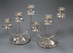 A stylish pair of modern three branch silver candelabra, Birmingham, 2000, 22cm.