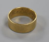 An early 20th century 18ct gold wedding band, 9.7 grams.