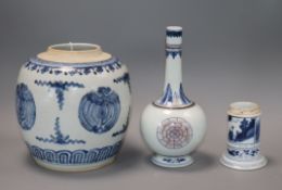 A Chinese blue and white jar, a similar pot and in underglaze blue and copper red vase, Kangxi and