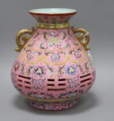 A Chinese pink sgraffito ground double wall vase height 30cm