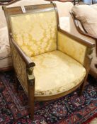 A French Empire style mahogany fauteuil, circa 1850, having gilt bronze mounts and tapered