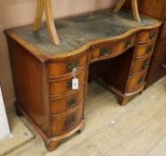 A George III style walnut pedestal desk W.115cm