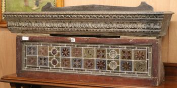 A late Victorian stained glass panel and a Victorian carved oak pediment W.107cm and 122cm