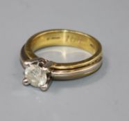 A diamond solitaire ring, 18ct yellow and white gold shank, size N.