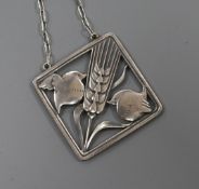 A Danish Georg Jensen sterling silver square pendant, depicting two robins with a wheatsheaf, no.