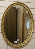 An Edwardian oval gilt framed wall mirror W.53cm