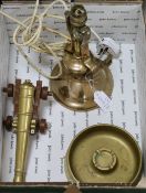 A Gimballed lamp, shell case, ashtray and brass cannon