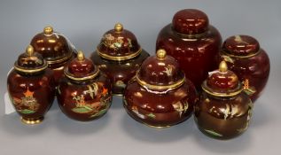 A pair of Carlton Ware Rouge Royale Pagoda ginger jars and covers, five similar small jars and