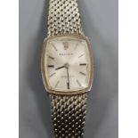 A lady's 9ct white gold Rolex Precision manual wind wrist watch, on a 9ct white gold bracelet (no