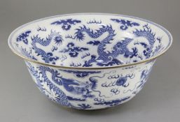 A large Chinese blue and white 'dragon' bowl, painted to the interior and exterior with