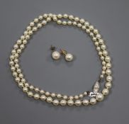 A Mikimoto single strand graduated cultured pearl necklace with white metal clasp, with box,