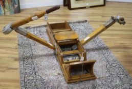 A vintage rowing machine retailed by Panarotto of Vicenza W.122cm