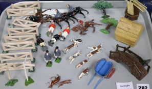 A collection of mostly Britains hunting hounds, huntsmen and ladies on horseback, windmill, haystack