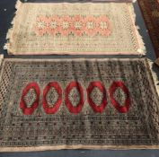 A Pakistan Bokhara rug, woven with five lozenge filled medallions, 158 x 94 cm, together with a pink
