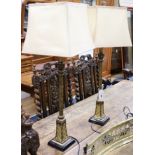 A pair of bronze effect turned wood table lamps