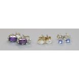 A pair of amethyst and white metal earrings and two other pairs of stud earrings