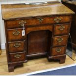 A mid 18th century walnut kneehole desk W.82cm