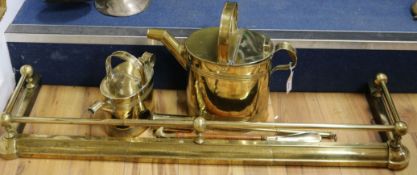 Two Victorian brass water cans and a brass kerb etc.