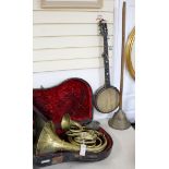 A cased horn, a French horn, a banjo etc (4)