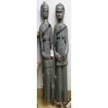 A pair of West African carved colonial figures tallest 118cm