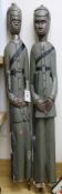 A pair of West African carved colonial figures tallest 118cm