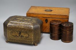 A 19th century Chinese lacquer tea caddy, a satinwood tea caddy and two lacquer canisters