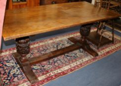 A 17th century style oak refectory table W.183cm