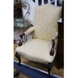 A Georgian style mahogany Gainsborough chair