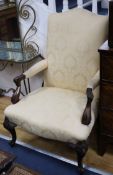 A Georgian style mahogany Gainsborough chair
