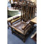 A set of seven Carolean style oak dining chairs (two having arms)