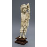 An early 20th century Chinese ivory figure of a farmer