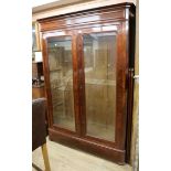 A 19th century French mahogany two door glazed bookcase W.156cm, H.216cm