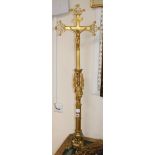 A gilt metal crucifix overall height 102cm