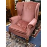 A walnut wing chair