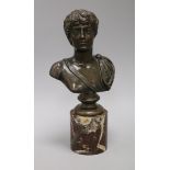 A bronze bust of an emperor, on red marble socle height 30cm
