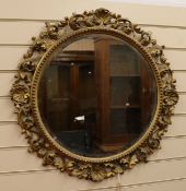 A Fiorentine carved gilt wood circular mirror W.72cm