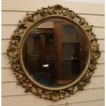 A Fiorentine carved gilt wood circular mirror W.72cm