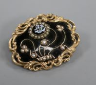 A Victorian gold plated, black enamel, split pearl and hardstone set mourning brooch, with foliate