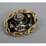 A Victorian gold plated, black enamel, split pearl and hardstone set mourning brooch, with foliate