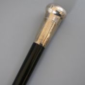 A late Victorian silver mounted ebonised cane, presented to Mr J Evans by The Santisima Glee Society