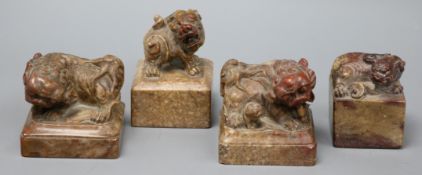 Four Chinese soapstone lion-dog seals