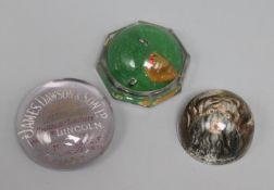 Three Victorian reverse intaglio moulded glass paperweights; parrot, dog's head and James Dawson &