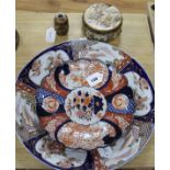 A large Japanese Imari charger, a smaller similar dish with scalloped edge and two Satsuma items,