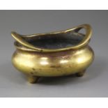 A Chinese bronze ding censer, Xuande mark but 18th/19th century, with a pair of high looped handles,