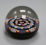 A Paul Ysart spaced concentric millefiori glass paperweight