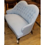 A small blue upholstered button back settee W.120cm