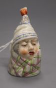 A Royal Worcester candle extinguisher of a man in a bed cap