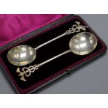 A cased pair of Victorian silver serving spoons with caduceus finials Aldwinckle & Slater, London,