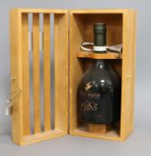 A Vintage 1965 Edition Rare bottle of Remy Martin, in padlocked case